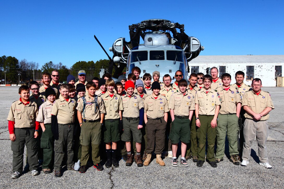 Boy Scout Troop 11 based out of Raleigh, N.C., poses for a group photo in front of a CH-53E Super Stallion at Blackstone Army Airfield, Va. Jan. 15, 2012. Troop 11 visited the Marines of the 24th Marine Expeditionary Unit during their Realistic Urban Training (RUT) exercise, scheduled from Jan. 5-20, which has the unit conducting off-base missions near the town of Farmville, Va. to prepare for the various missions they may face during their upcoming deployment. (Official USMC Photo by: Corporal Michael Petersheim/Released)