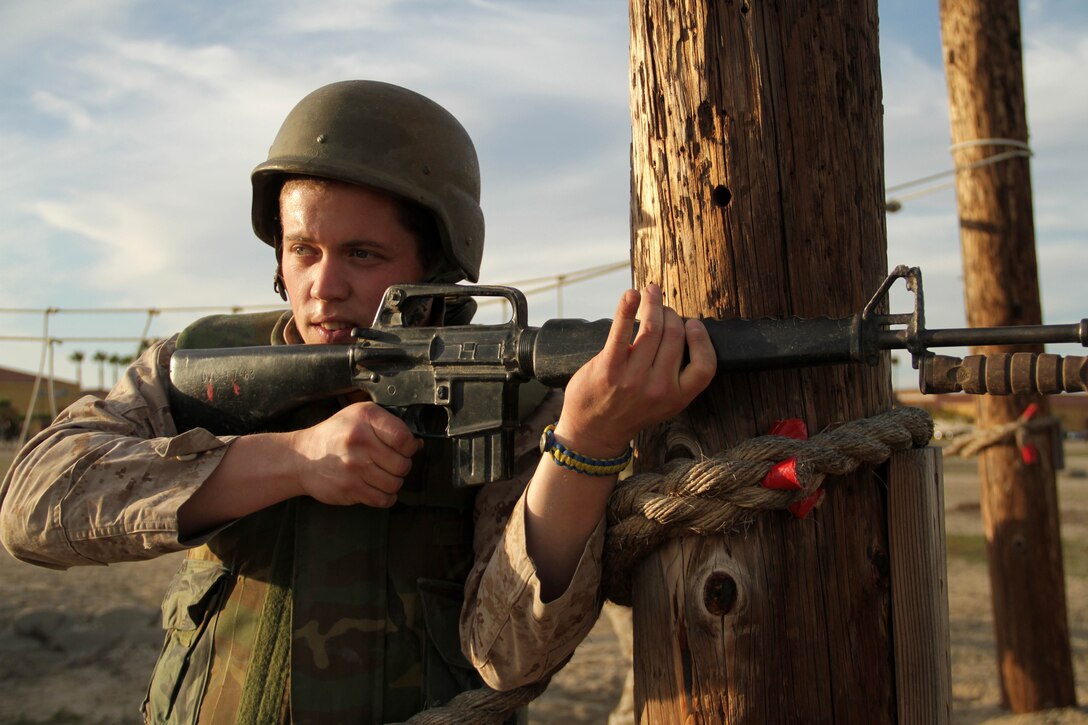 Erik Dietz, a teacher at Hastings High School, waits for the rest of his squad before moving toward the next bayonet assault course obstacle Jan. 10 during the Recruiting Station Twin Cities 2012 Educators Workshop. For additional imagery from the event, visit www.facebook.com/rstwincities.