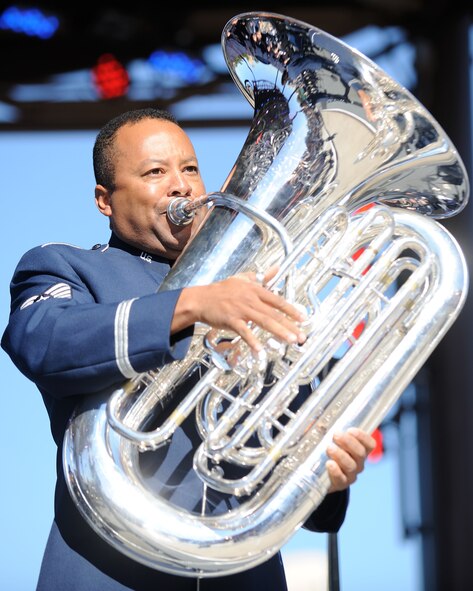 U.S. Air Force Tech. Sgt. Willie Clark Jr., a tubist with the U.S. Air Force Band Ceremonial Brass, plays "Stars and Stripes Forever" during a concert at Downtown Disney in Orlando, Fla., Jan. 15, 2012. Clark, a founding member of the Walt Disney World tuba quartet "The Tubafours" from 1990-2000, is on tour with the U.S. Air Force Band Ceremonial Brass during a winter tour of Florida. (U.S. Air Force photo by Master Sgt. Adam M. Stump/RELEASED)