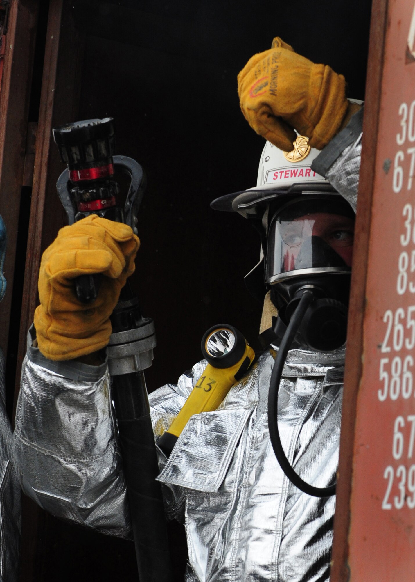 Master Sgt. Kile Stewart, the Kabul Air Base fire emergency services advisor with the 439th Air Expeditionary Advisory Squadron, gives the thumbs up to a fire team of Afghan army and air force firefighters during a live fire training exercise at Kabul International Airport, Jan. 15, 2012. Stewart is currently deployed from Patrick Air Force Base, Fla., to provide advisor training to AAF and ANA firefighters. (Photo by Staff Sgt. Nadine Y. Barclay)