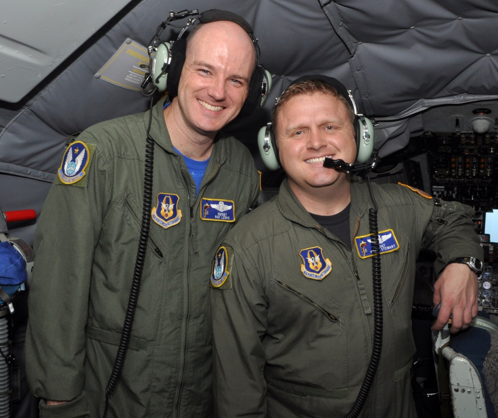 Senior Master Sgt. Ray Lewis, a refueling boom operator assigned to the 18th Air Refueling Squadron, 931st Air Refueling Group, McConnell Air Force Base, Kan., poses with fellow boom operator, Tech. Sgt. Kenny Stewart, during a civic leader flight, April 1, 2011.  Lewis has been a boom operator on the KC-135 Stratotanker for more than twenty years.  (U.S. Air Force photo by Master Sgt. Jeff Walston)
