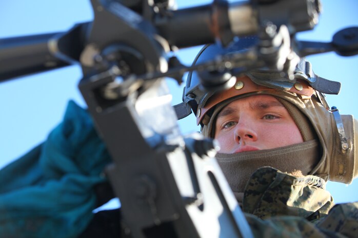 Cpl. Charles Ulrich, a flightline mechanic with Marine Medium Tiltrotor Squadron VMM-261 (Reinforced), 24th Marine Expeditionary Unit, works on an AH-1 Super Cobra helicopter Jan. 13, 2012, here. The Sparta, N.J., native said he joined the Marine Corps because he wanted to work on helicopters and be a Marine like his grandfather. The unit's upcoming deployment will be the first time the Iraq war veteran will deploy with a MEU. 
