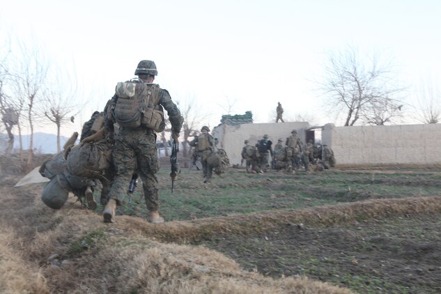Marines with 1st Battalion, 8th Marines Regiment unload from MV-22B Osprey in Helmand province, Afghanistan, Jan. 17. This was the last mission flown during Marine Medium Tiltrotor Squadron 162’s six month deployment in Helmand province, Afghanistan.