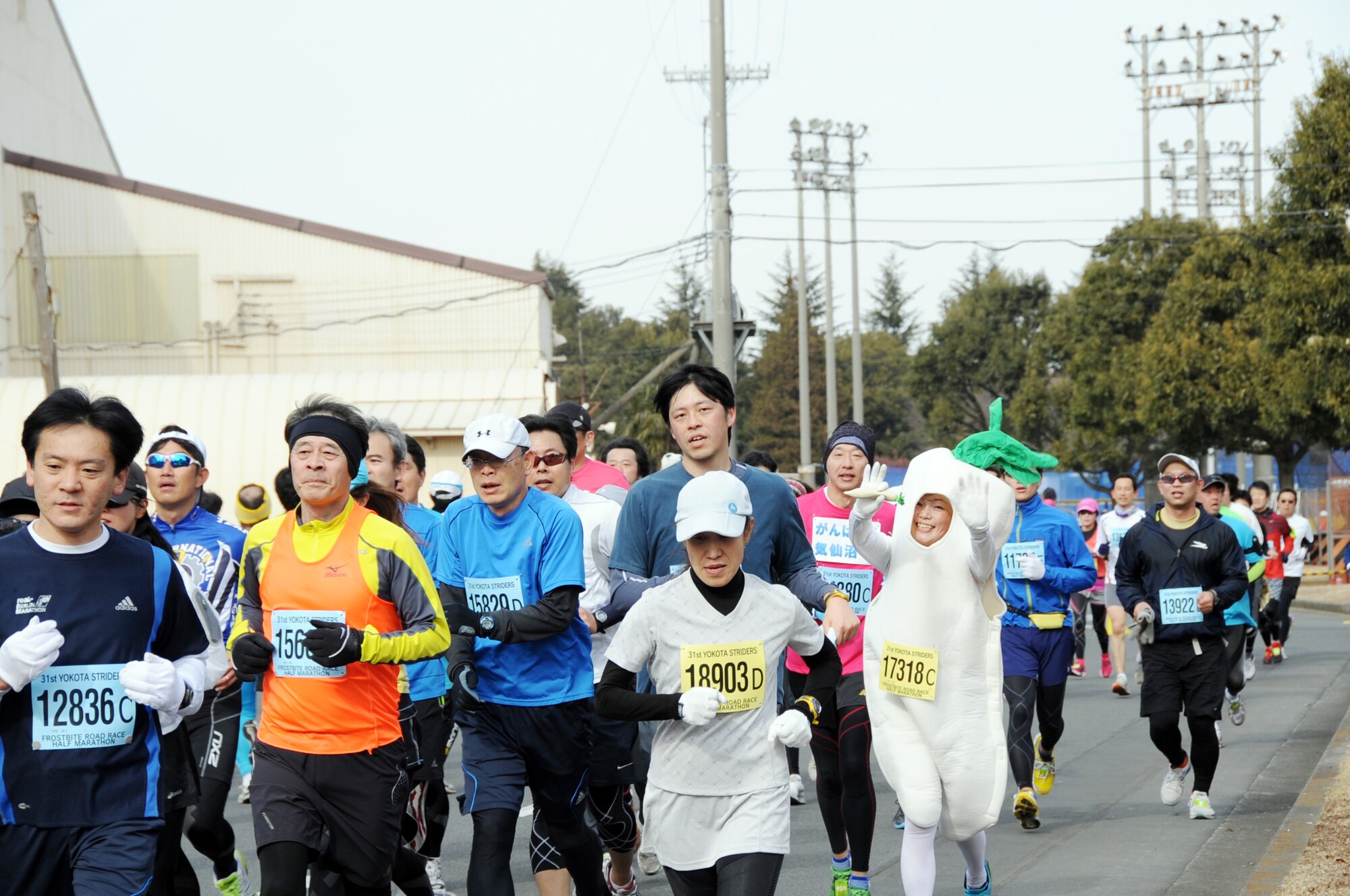 YOKOTA AIR BASE, Japan -- The Yokota Striders Running Club sponsored the 31th Annual Frostbite Run held at Yokota Air Base, Japan, Jan. 15, 2012. More than 10,000 runners participated in the event. For the third year in a row, Yoichi Kohno won first place, finishing the Men's Half Marathon with a time of 1:08:46. Hirose Mitsuko, took fist place in the Women's Half Marathon with a time of 1:19:46. (U.S. Air Force photo/Naoko Kurokui)