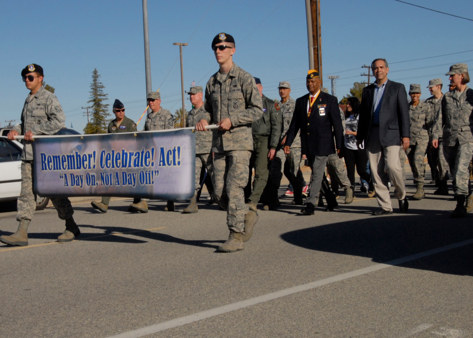 Team Edwards honors the memory of Martin Luther King Jr. with a celebratory walk from Building 3000 to Chapel 1. The banner leading the way reminds everyone that the observance is a day to act and get involved within the community. (U.S. Air Force Photo by Laura Mowry)