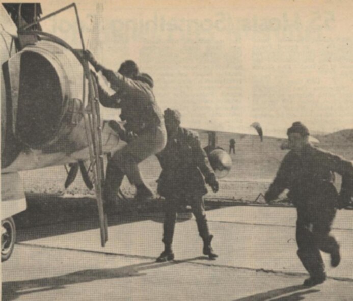 LET’S GO- Racing to their planes during an exercise are F-102 Delta Dagger pilots Maj. Ronald N. Hoelzer (Left) and Maj. George F. McCarty. In the background is SSgt. Roy O. Worthington, Major Hoelzer’s crew chief. (Courtesy photo) 
