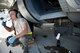 U.S. Air Force Senior Airman Sean McGuirk, a hydraulics technician for 4th Aircraft Maintenance Unit, interacts with fellow Airman during aircraft maintenance on an AC-130U Spooky on Hurlburt Field, Fla., Jan. 12, 2012. The 4th AMU maintainers perform on-equipment flightline tasks; pre- and post-flight serviceability inspections; and aircraft system repair and minor modifications helping to ensure aircraft return safely. (U.S. Air Force photo/Airman 1st Class Christopher Williams)(Released)
