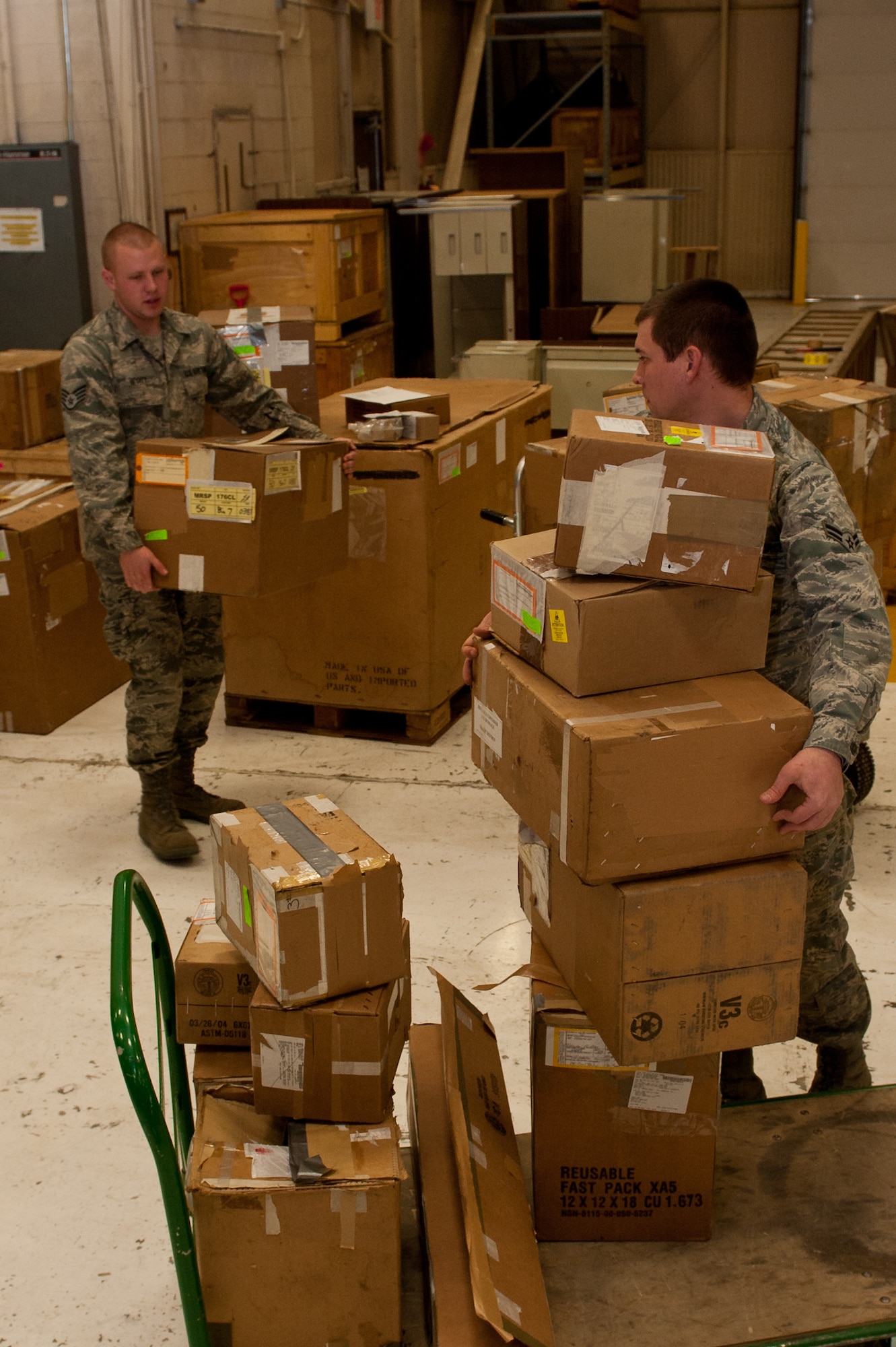 Staff Sgt. Cody Wyatt, 28th Logistics Readiness Squadron Mobility Readiness Spares Package and aircraft parts store supervisor, and Airman 1st Class Matthew Reynaud, 28th LRS aircraft parts technician, stack B-1 parts for packing into an MRSP at Ellsworth Air Force Base, S.D., Jan. 10, 2012. Both will travel with the MRSP to Nellis AFB, Nev., as part of Red Flag, a combat training exercise that tests pilots and aircrews with real world scenarios. (U.S. Air Force photo by Airman 1st Class Kate Thornton/Released)