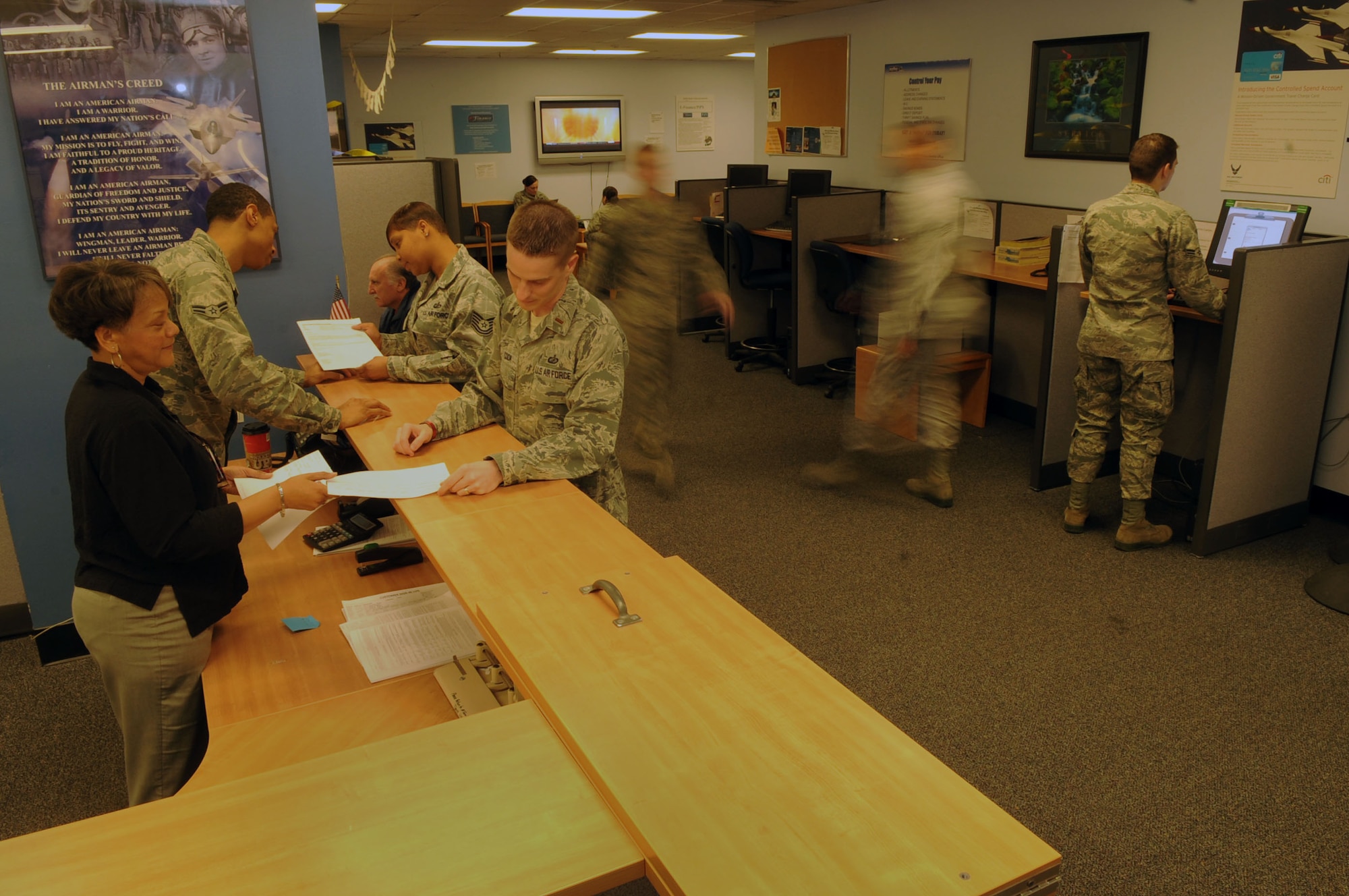 The 633rd Comptroller Squadron Finance Customer Service Office stays busy with customers who need assistance with Basic Allowance for Housing, travel vouchers, and personnel who are permanently changing stations at Langley AFB, Va., Jan. 10, 2012. The 633rd CPTS disburses more than $1.45 billion dollars annually, maintains and disburses payroll data for 10,815 military and civilian personnel, and provides financial support for worldwide contingencies. (U.S. Air Force photo by Staff Sgt. Jeff Nevison/Released)