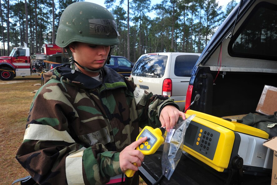 U.S. Air Force Senior Airman Amanda Johnson, 23rd Aerospace Medical Squadron bioenvironmental engineer, collects and tests air samples during an operational readiness exercise at Moody Air Force Base, Ga., Jan. 11, 2012. While in an actual deployed location, bioenvironmental can test air and detect potential chemical warfare. (U.S. Air Force photo by Staff Sgt. Stephanie Mancha/Released)  