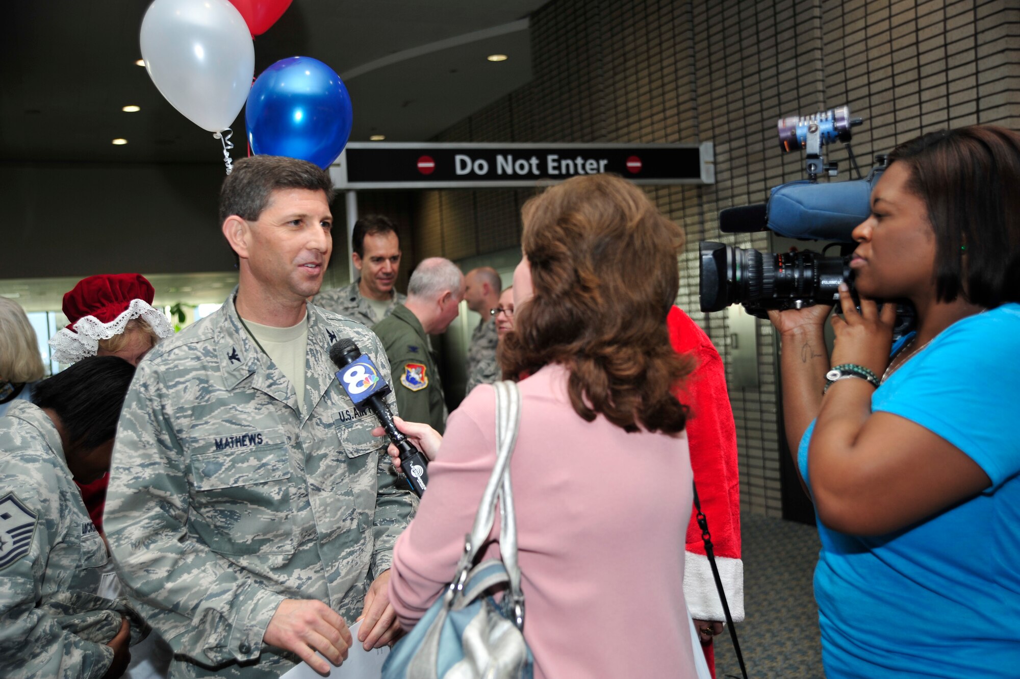 TAMPA, FL -- As a hometown hero, Col. Ted Matthews, vice wing commander of the 927th Air Refueling Wing, based out of MacDill Air Force Base, Fla., greeted news crews and friends after nearly nine months in Iraq.  While in Iraq, Mathews commanded the 407 Air Expeditionary Group, a unit charged with runway operations for the last military airport to close with the drawdown efforts.(Official U.S. Air Force photo courtesy of Airman 1st Class Shandresha Mitchell)