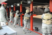 Tech. Sgt. William Graham, 902nd Security Forces Squadron, supervises Joint Base San Antonio-Randolph personnel during M-4 carbine qualification training Jan. 12. Training was held at the small arms range on JBSA-Randolph. (U.S. Air Force photo/Rich McFadden) (released)