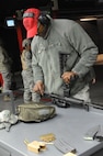 Tech. Sgt. William Graham, 902nd Security Forces Squadron, performs on-site maintenance during M-4 carbine qualification training Jan. 12. Training was held at the small arms range on Joint Base San Antonio-Randolph. (U.S. Air Force photo/Rich McFadden) (released)