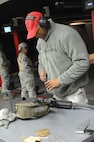 Tech. Sgt. William Graham, 902nd Security Forces Squadron, performs on-site maintenance during M-4 carbine qualification training Jan. 12. Training was held at the small arms range on Joint Base San Antonio-Randolph. (U.S. Air Force photo/Rich McFadden) (released)