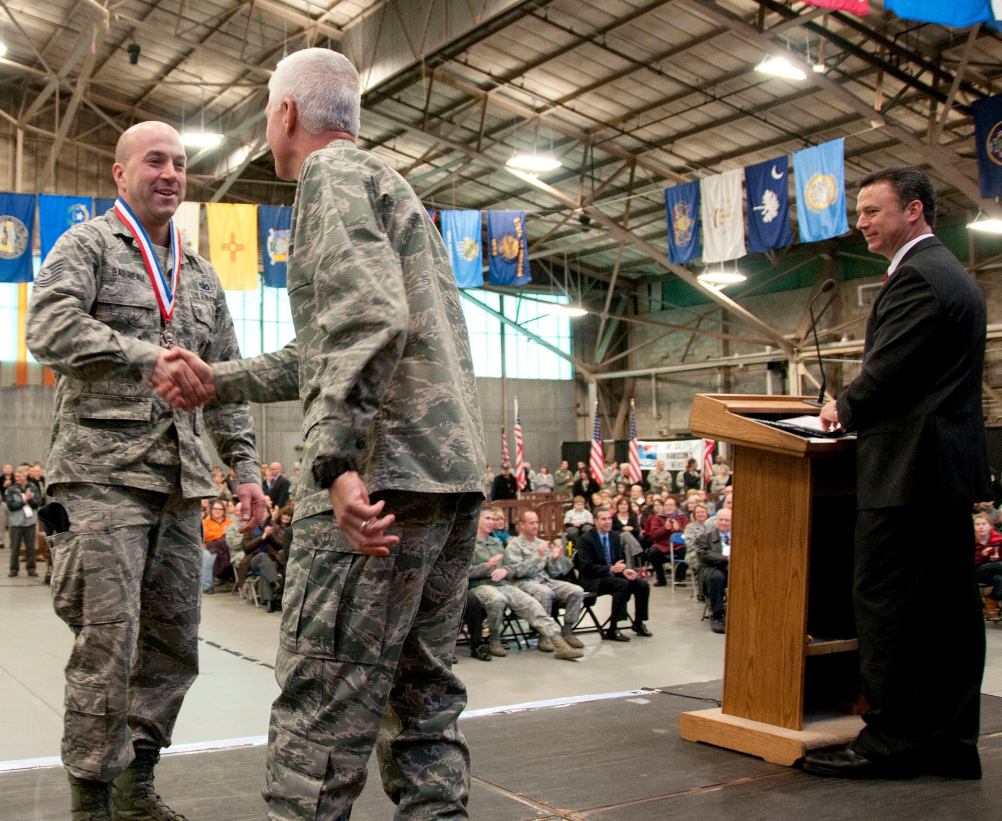 HANSCOM AIR FORCE BASE, Mass. –Tech. Sgt. David Babineau, a flight chief with the 66th Security Forces Squadron, is welcomed home by Lt. Gen. CR Davis, Electronic Systems Center commander, during a homecoming celebration at Jan. 12. The event officially welcomed home 54 Airmen who have returned from a deployment during the past six months. (U.S. Air Force photo by Mark Wyatt)