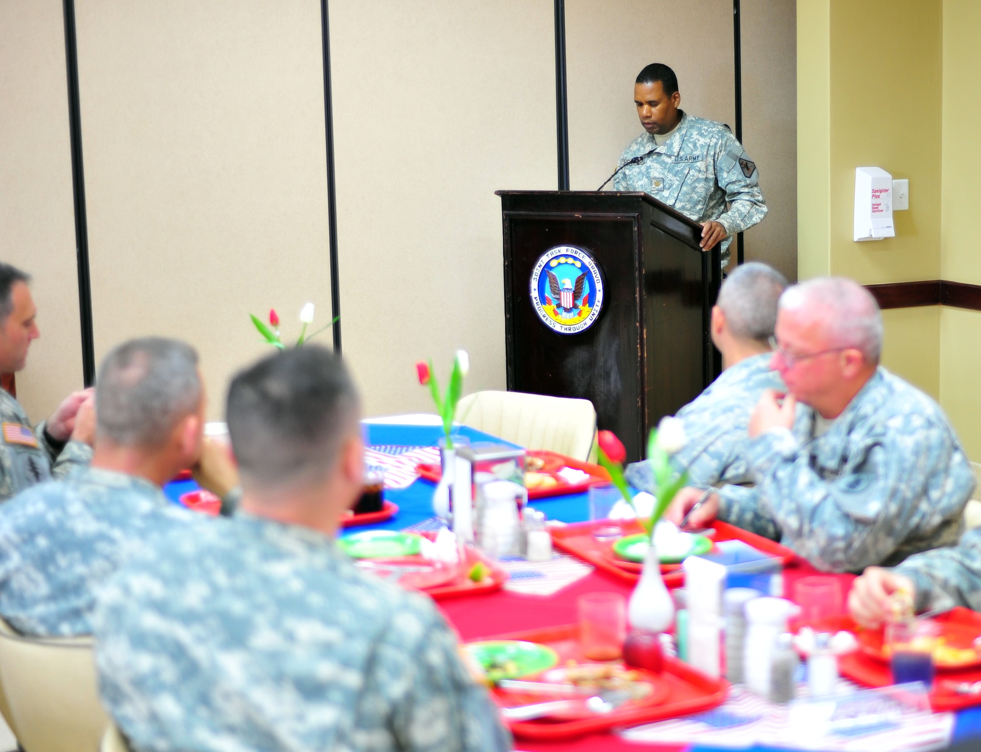 SOTO CANO AB, Honduras ? Major Adrian Henderson, Joint Task Bravo ? Force staff judge advocate, gives the key note speech during the Dr. Martin Luther King, Jr. luncheon Jan. 12 at the dining facility in front of more than 50 servicemembers. The Dr. Martin Luther King, Jr., holiday was established in 1983 and was set to be on the third Monday of January to celebrate the civil-rights leader?s birthday Jan. 15. (Air Force photo/Staff Sgt. Bryan Franks)