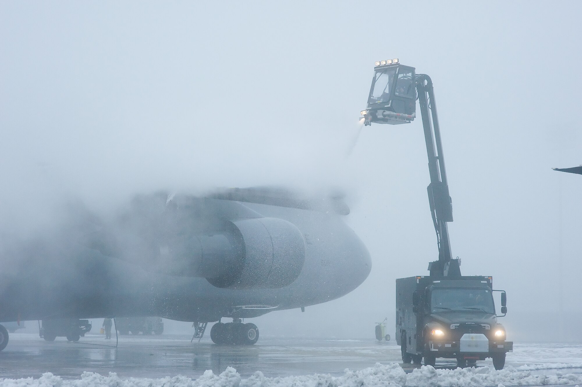 436th Aircraft Maintenance Squadron personnel de-ice a C-5 Jan. 28, 2009, at Dover Air Force Base, Del. De-icing is done as many times as necessary until the aircraft depart Dover Air Force Base, Del. (U.S. Air Force photo by Roland Balik)