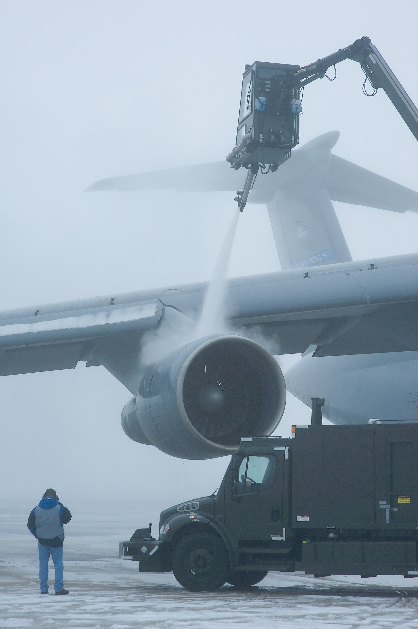 436th Aircraft Maintenance Squadron personnel de-ice a C-5 Jan. 28, 2009, at Dover Air Force Base, Del. De-icing is done as many times as necessary until the aircraft depart Dover Air Force Base, Del. (U.S. Air Force photo by Roland Balik)