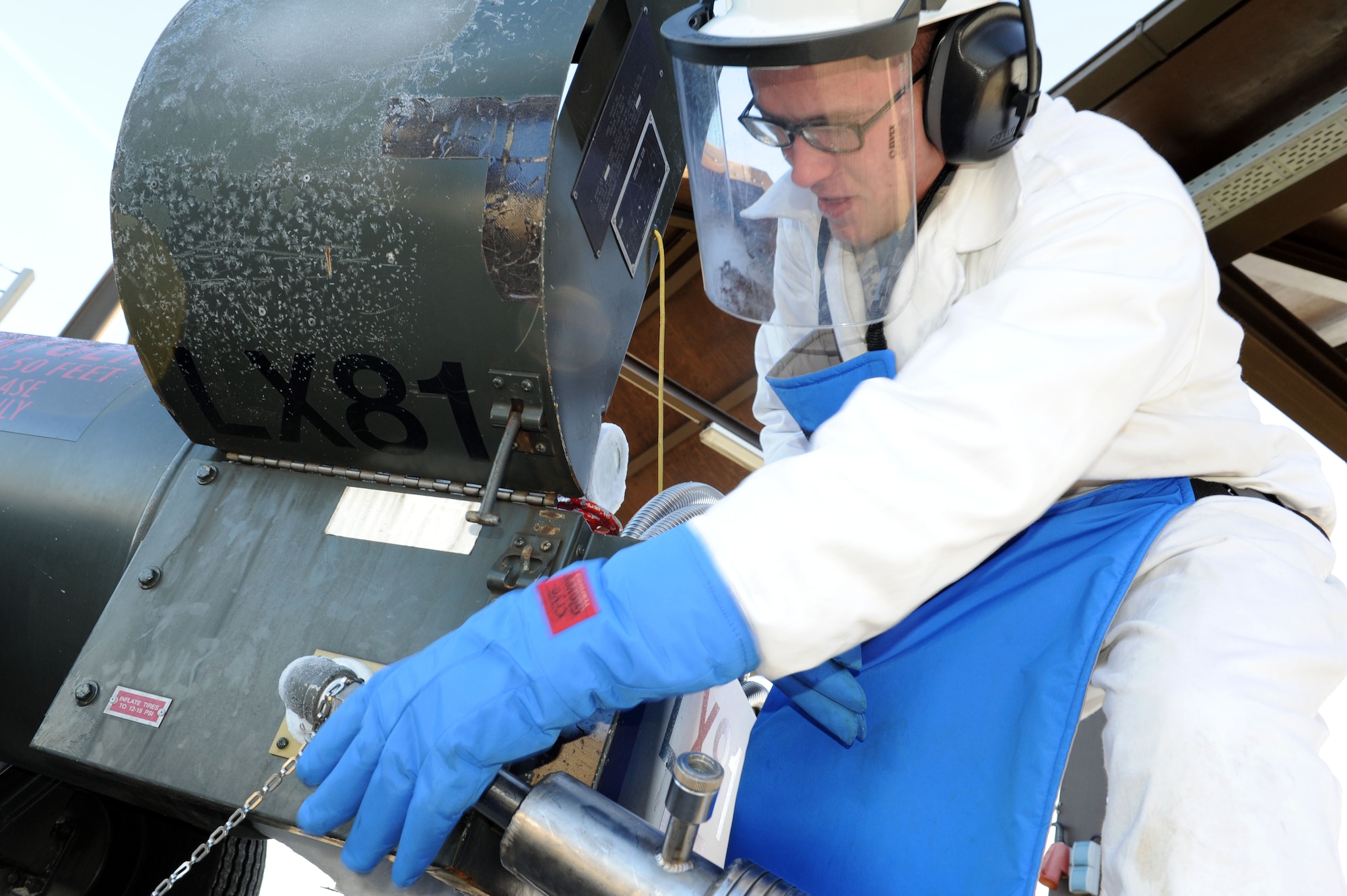 SPANGDAHLEM AIR BASE, Germany – Airman 1st Class Kyle Coates, 52nd Logistics Readiness Squadron hydrant operator, connects an issuing hose to a liquid oxygen receiving cart during a daily issuing of LOX here Jan. 17. The cryogenics shop supports the cargo planes with oxygen ensuring the planes are mission ready. (U.S. Air Force photo / Senior Airman Christopher Toon)