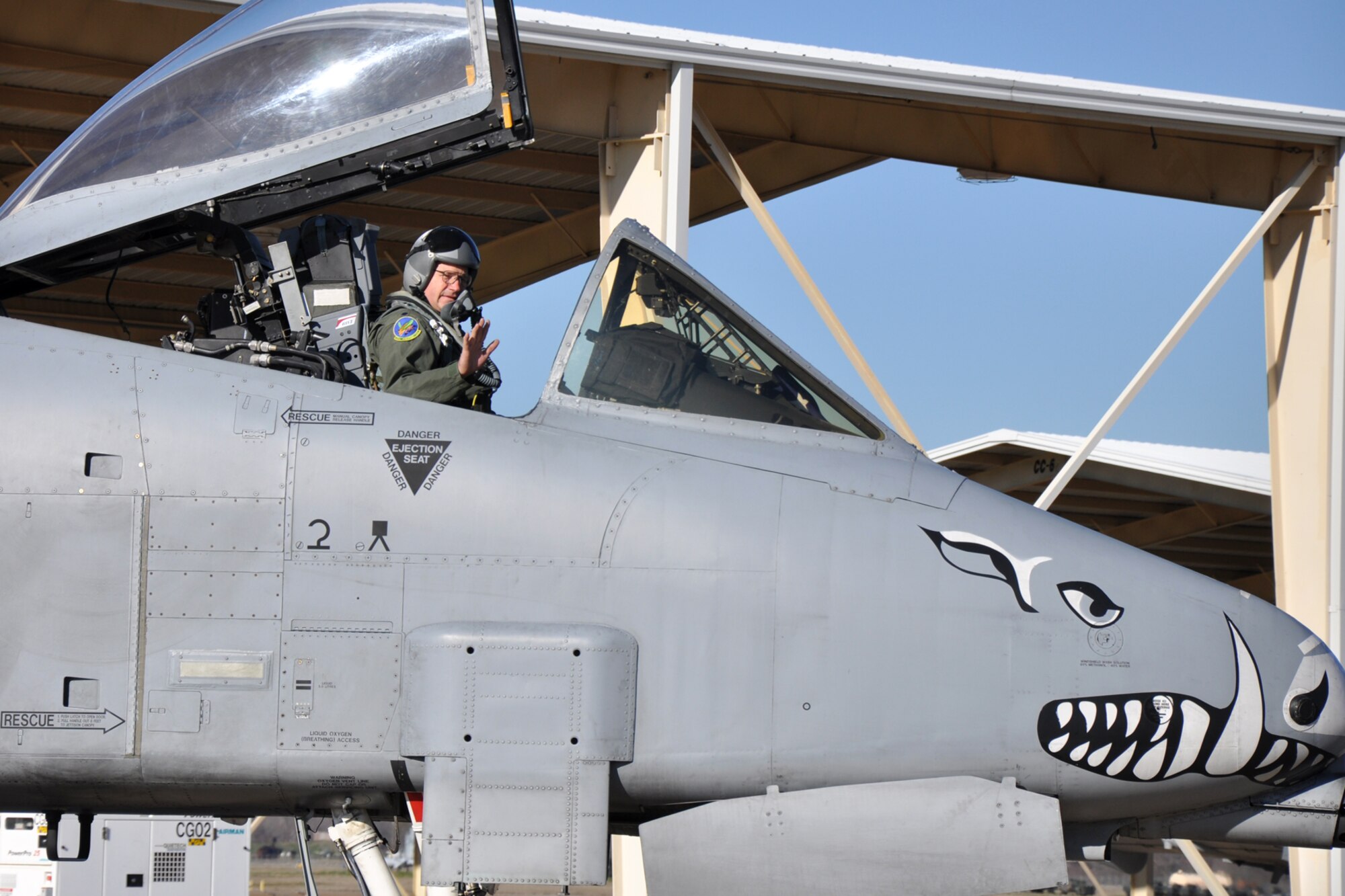Lt. Col. Marc Olson, an A-10 pilot assigned to the 47th Fighter Squadron, waves as he taxis an A-10 Thunderbolt II to the runway at Barksdale Air Force Base, La., Jan. 11, 2012. Olson led a four-ship sortie, and in doing so accumulated 5,000 hours in the A-10. To complete this feat took Olson more than twenty and a half years of flying the A-10. (U.S. Air Force photo by Master Sgt. Jeff Walston/Released)