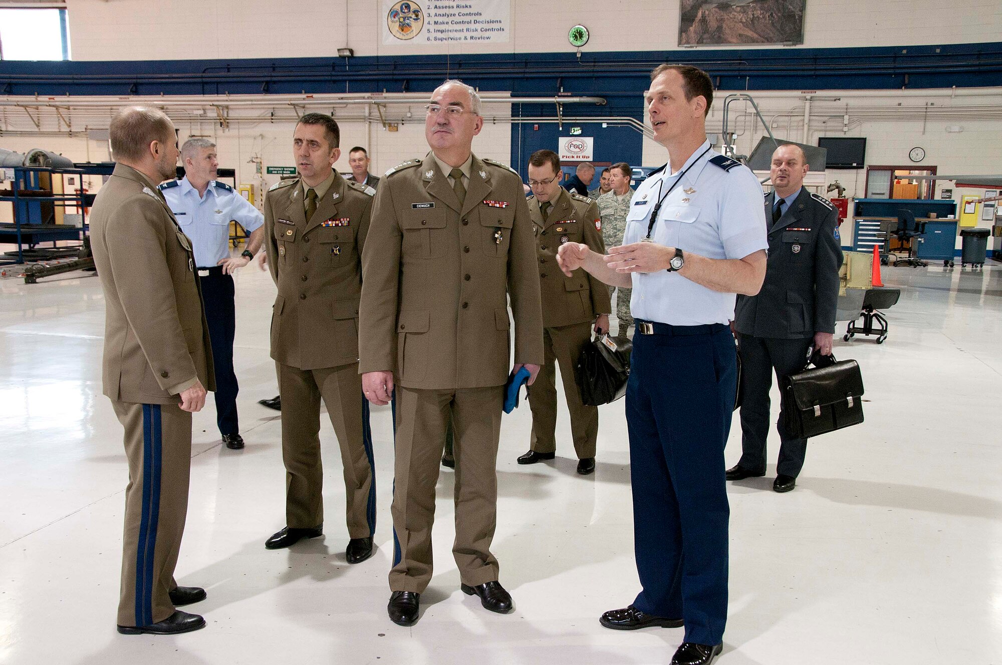 Polish Army Gen. Mieczyslaw Cieniuch (center), Chief of the General Staff of the Polish Armed Forces, is escorted on a tour of 162nd Fighter Wing aircraft maintenance facilities by Col. Jim Taylor, 162nd Maintenance Group commander. (U.S. Air Force photo/Master Sgt. Dave Neve)