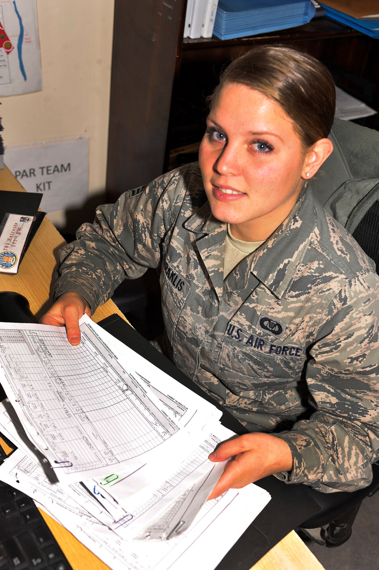 BAGRAM AIRFIELD, Afghanistan—Senior Airman Ashley Daraklis organizes paperwork at Bagram Airfield, Afghanistan, Jan. 15, 2012. Daraklis is an aviation resource manager with the 119th Expeditionary Force Squadron.  She is deployed from the 177th Fighter Wing in N.J., and she was chosen as Warrior of the Week, an award designed to recognize hard-working Airmen for their integrity and commitment to excellence. (U.S. Air Force photo/ Airman 1st Class Ericka Engblom)