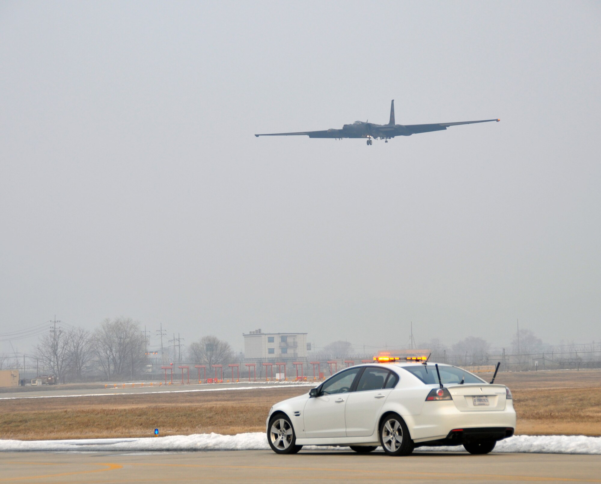 Maj. Carl Maymi, 5th Reconnaissance Squadron U-2 pilot, awaits an incoming U-2 “Dragon Lady” at Osan Air Base, Republic of Korea, Jan. 11, 2012. During a routine flight, U-2 pilots fly eight-hour missions on average. (U.S. Air Force photo/Airman 1st Class Michael Battles)