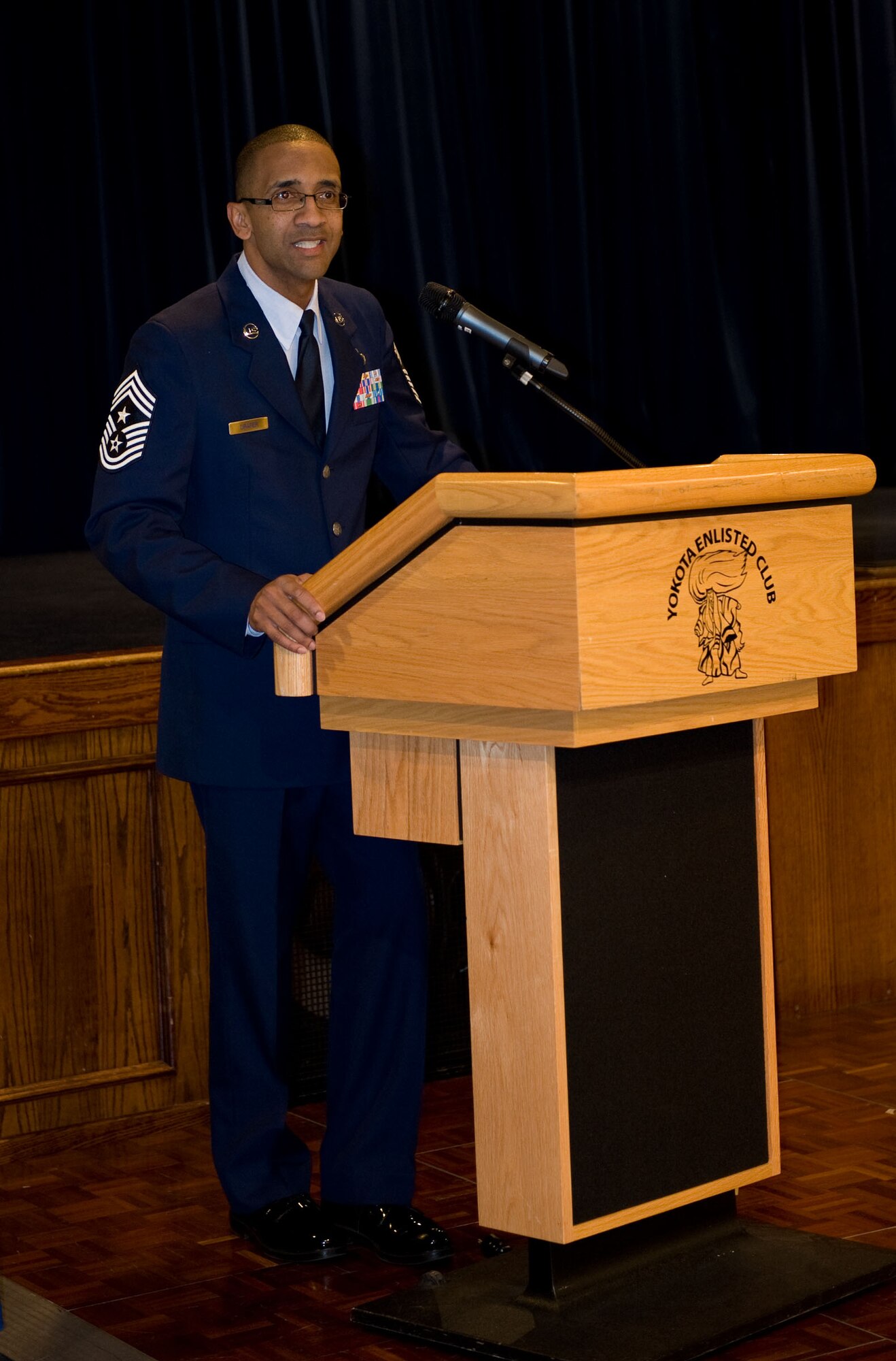 YOKOTA AIR BASE, Japan -- Chief Master Sgt. Ronald Draper, 374th Airlift Wing command chief, speaks during the annual Martin Luther King Jr. event at Yokota Air Base, Japan, Jan. 13, 2012. Draper spoke about Dr. King's accomplishments and his legacy. The event was held in honor of Dr. Martin Luther King Jr., and his accomplishments. (U.S. Air Force photo/Airman 1st Class Krystal M. Garrett)

