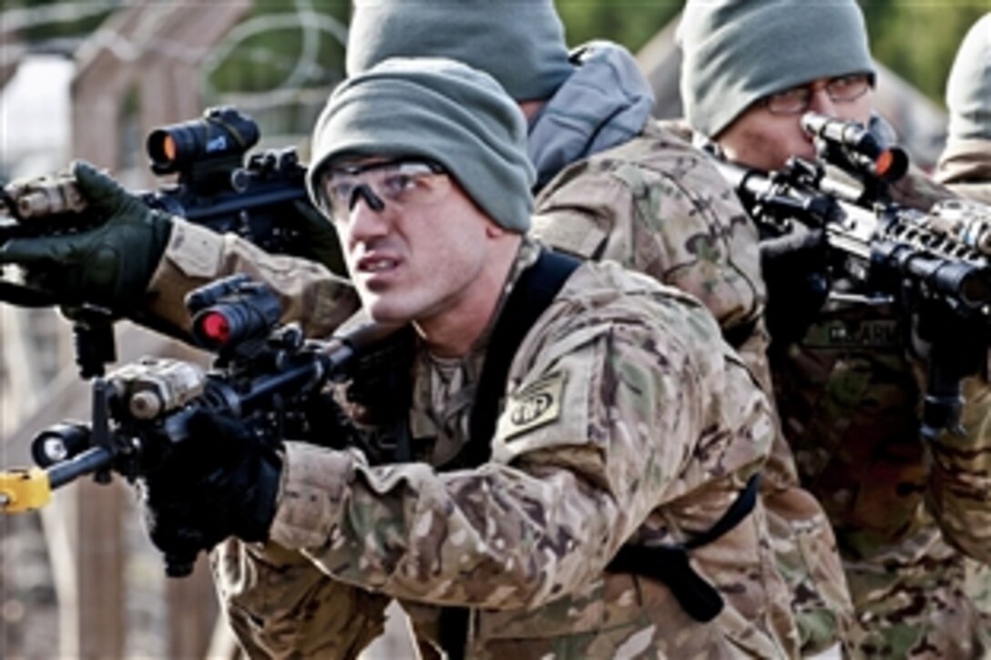 Paratroopers practice assembling into a stack to clear a building at the Joint Readiness Training Center on Fort Polk, La., Jan. 13, 2012. Each paratrooper is assigned to watch for threats from a different direction. The paratroopers are assigned to the 82nd Airborne Division's 1st Brigade Combat Team. 