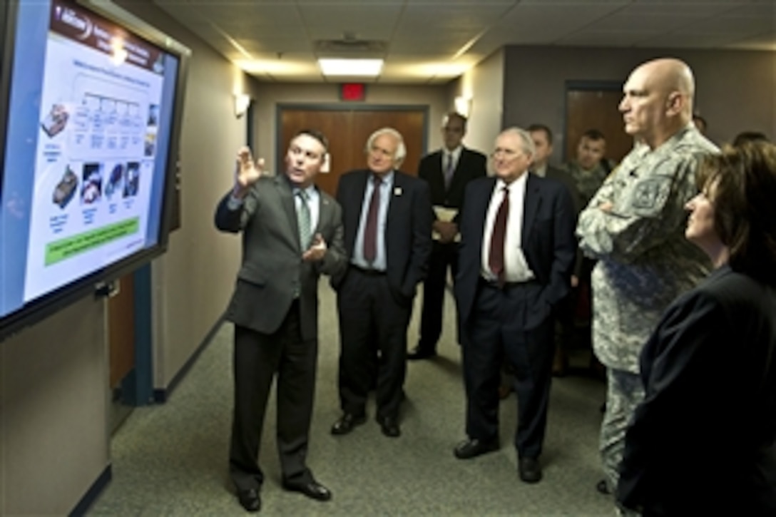 Army Chief of Staff Gen. Raymond T. Odierno, second from left, U.S. Sen. Carl Levin, of Michigan, Senate Armed Services Committee chairman, center left, and his brother, U.S. Rep. Sander Levin, also of Michigan, center right, visit the facilities of the U.S. Army Life Cycle Management Command, formerly known as the Tank-automotive and Armaments Command at Detroit Arsenal in Warren, Mich., Jan. 12, 2012.