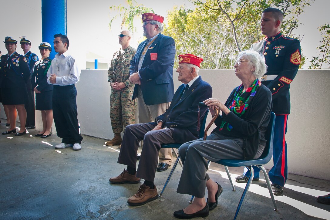 James C. Phillips, an Iwo Jima veteran, is honored by cadets and students at G. Holmes Braddock Senior High School in Miami, Fla., Jan. 18, 2012. The school’s Junior Naval Reserve Officer Training Corps painted a mural of the iconic flag raising on Mount Suribachi as a testament to Phillips and all veterans.    “Jack,” as his friends call him – his father’s name – was recognized for his service as a machine gunner with the 5th Marine Division on Iwo Jima.