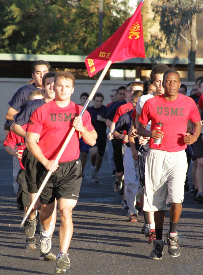 Joseph Koestner, (left), a 22-year-old graduate of Arizona State University, leads a platoon of future Marines from Recruiting Substation Tempe, Recruiting Station Phoenix, on a 2-mile run during a weekly exercise function.  Koestner's recruiter, Staff Sgt. Karl Martin, believes Koestner has the potential to earn the distinction as company honor man when he graduates recruit training in the summer of 2012. (U.S. Marine Corps photo by Sgt. Fredrick J. Coleman)