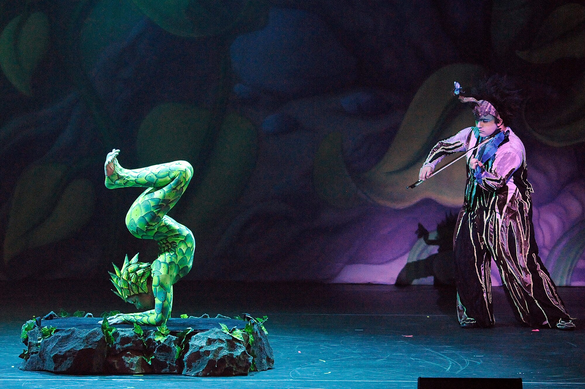 MISAWA CITY, Japan - A Cirque Dreams contortionists bends her body in unusual ways during the Jungle Fantasy World Tour show held at the Misawa Civic Center Jan. 18. Cirque Dreams Jungle Fantasy World Tour performs for servicemembers and their families as part of an Armed Forces Entertainment show. (U.S. Air Force photo/Tech. Sgt. Marie Brown)