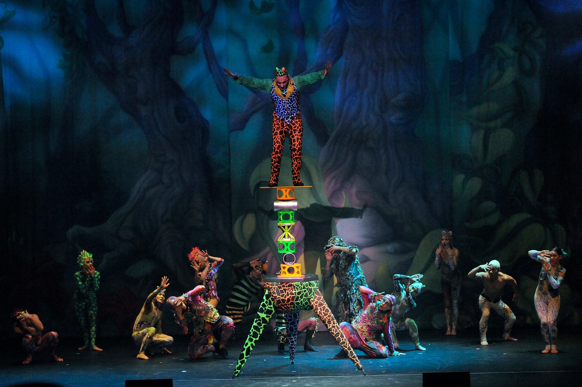 MISAWA CITY, Japan - Performers end the Cirque Dreams Jungle Fantasy World Tour show with a high-rise balancing act at the Misawa Civic Center Jan. 18. The feats performed in the Cirque Dreams show were enhanced with colorful costumes that were brought to life in a fantastical jungle setting by visual effects. (U.S. Air Force photo/Tech. Sgt. Marie Brown)