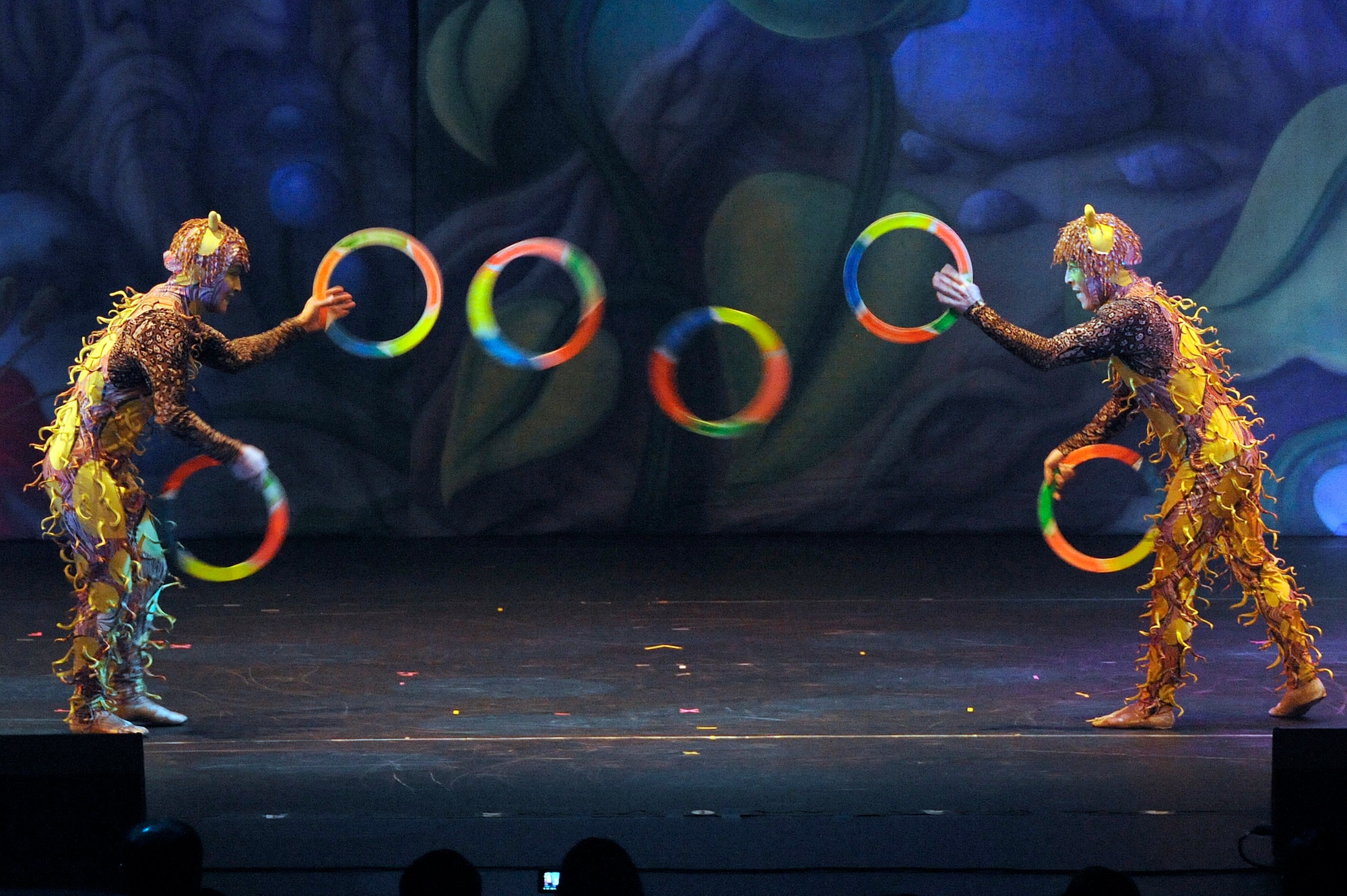 MISAWA CITY, Japan - Performers dressed in nature costumes juggle rings back and forth to each other during the Cirque Dreams Jungle Fantasy World Tour show held at the Misawa Civic Center in Misawa City Jan. 18. Cirque Dreams Jungle Fantasy has performed over 2,000 shows between 2007 and 2011 to approximately 3.5 million people in more than 170 cities throughout North America. (U.S. Air Force photo/Tech. Sgt. Marie Brown)