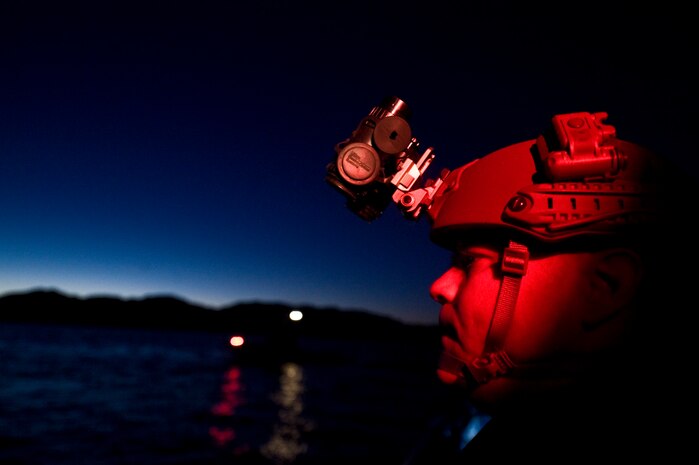 A U.S. Air Force independent duty medical technician, 58th Rescue Squadron, stands by for pararescuemen, 58th Rescue Squadron, to perform a military freefall water jump at Echo Bay, Nev Jan. 12, 2012, at Nellis Air Force Base, Nev. Pararescuemen are trained to provide emergency medical treatment in adverse terrain and conditions in combat or peacetime. (U.S. Air Force photo by Airman 1st Class Daniel Hughes/Released)
