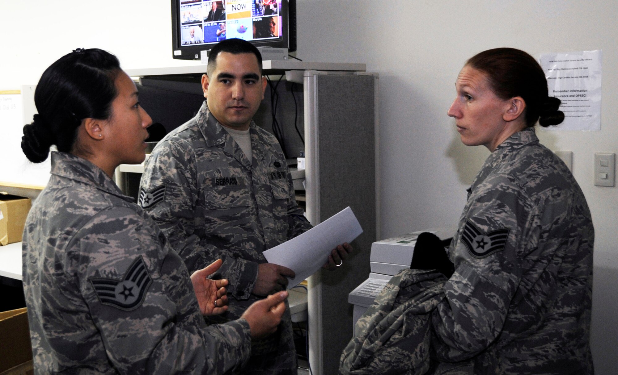 MISAWA AIR BASE, Japan – Staff Sgt. Shawna Priest, 35th Communications Squadron, wing information assurance manager, discusses with Staff Sgts. Melissa Campbell, American Forces Network, broadcast maintenance technician and Candido Serrato, AFN, non-commissioned officer in charge of broadcast maintenance about AFN detachment 12's possible IA improvements here, Jan. 18. Misawa will be inspected on communication security, computer security and emissions security. Airmen are advised to get in contact with their unit IA officer if they have any questions. (U.S. Air Force photo by Airman 1st Class Kaleb Snay)