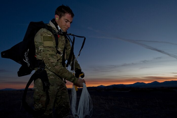 A U.S. Air Force pararescueman, 58th Rescue Squadron, untangles his equipment during a military freefall jump Jan. 11, 2012, at Wendover Field, Utah. Pararescuemen are trained to provide emergency medical treatment in adverse terrain and conditions in combat or peacetime. (U.S. Air Force photo by Airman 1st Class Daniel Hughes/Released)


