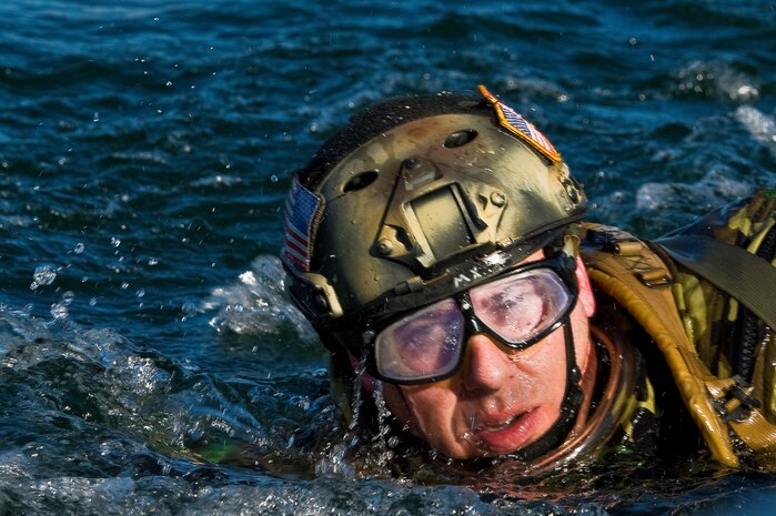 A U.S. Air Force pararescueman, 58th Rescue Squadron, swims toward a Rigging, Alternate Method Zodiac during a military freefall water jump Jan. 10, 2012, at Echo Bay, Nev. Pararescuemen are trained to provide emergency medical treatment in adverse terrain and conditions in combat or peacetime. (U.S. Air Force photo by Staff Sgt. William Coleman/Released)
