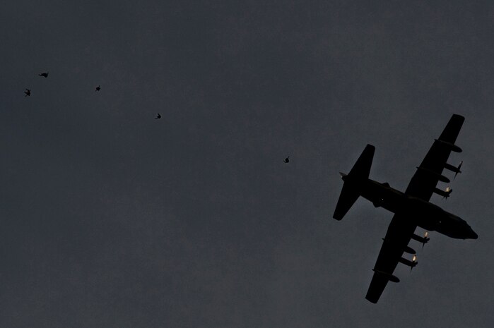 U.S. Air Force pararescuemen, 58th Rescue Squadron, perform a free fall jump mission out of a C-130 Hercules, Air National Guard, Long Island, NY, during a military freefall jump Jan. 11, 2012, over Wendover Field, Utah. Pararescuemen are trained to provide emergency medical treatment in adverse terrain and conditions in combat or peacetime. (U.S. Air Force photo by Airman 1st Class Daniel Hughes/Released)
