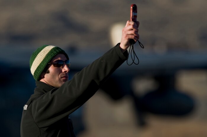 A U.S. Air Force pararescueman, 58th Rescue Squadron, checks wind speeds to attain an accurate jump pattern during a military freefall jump Jan. 11, 2012, at Wendover, Utah. Pararescuemen are trained to provide emergency medical treatment in adverse terrain and conditions in combat or peacetime. (U.S. Air Force photo by Airman 1st Class Daniel Hughes/Released)
