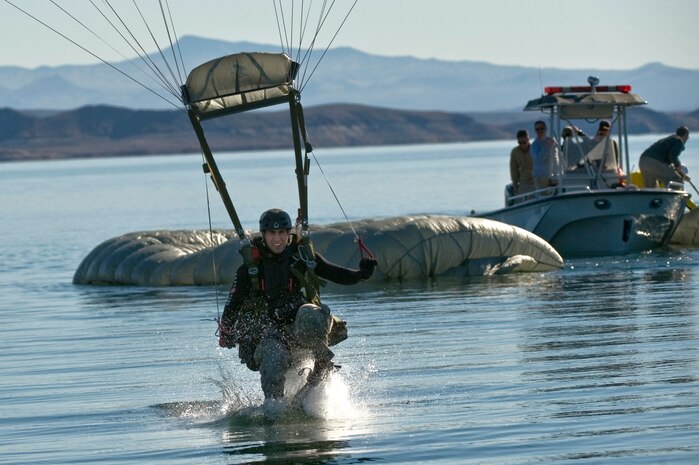 A U.S. Air Force pararescueman, 58th Rescue Squadron, prepares for a water landing during a military freefall water jump Jan. 10, 2012, at Echo Bay, Nev. Pararescuemen are trained to provide emergency medical treatment in adverse terrain and conditions in combat or peacetime. (U.S. Air Force photo by Staff Sgt. William Coleman/Released)

