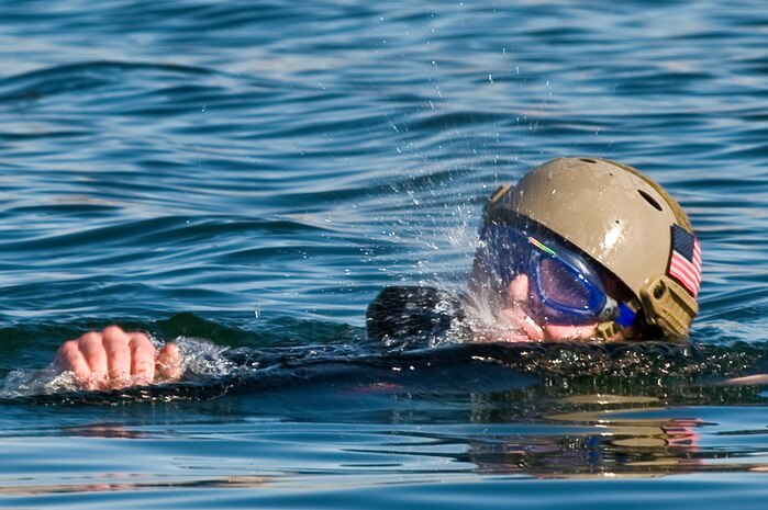 A U.S. Air Force pararescueman, 58th Rescue Squadron, swims toward a Rigging, Alternate Method Zodiac during a military freefall water jump Jan. 10, 2012, at Echo Bay, Nev. Pararescuemen are trained to provide emergency medical treatment in adverse terrain and conditions in combat or peacetime. (U.S. Air Force photo by Staff Sgt. William Coleman/Released)
