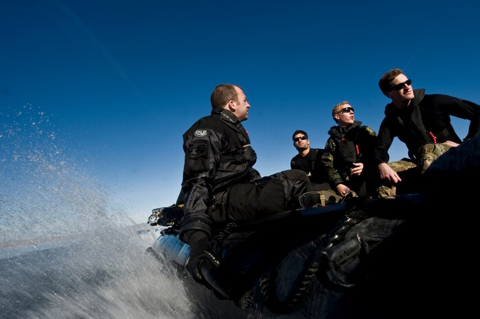 U.S. Air Force combat rescue officer and pararescuemen, 58th Rescue Squadron, head back to the staging area in a zodiac boat during a military freefall water jump Jan. 10, 2012, at Echo Bay, Nev. CROs are trained to lead pararescuemen who provide emergency medical treatment in adverse terrain and conditions in combat or peacetime. (U.S. Air Force photo by Airman 1st Class Daniel Hughes/Released)
