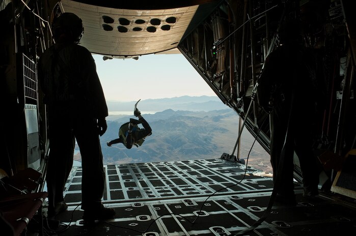 A U.S. Air Force pararescueman, 58th Rescue Squadron, jumps out of a C-130 Hercules, Air National Guard, Long Island, NY, during a military freefall water jump Jan. 10, 2012, over Echo Bay, Nev. Pararescuemen are trained to provide emergency medical treatment in adverse terrain and conditions in combat or peacetime. (U.S. Air Force photo by Staff Sgt. Christopher Hubenthal/Released)
