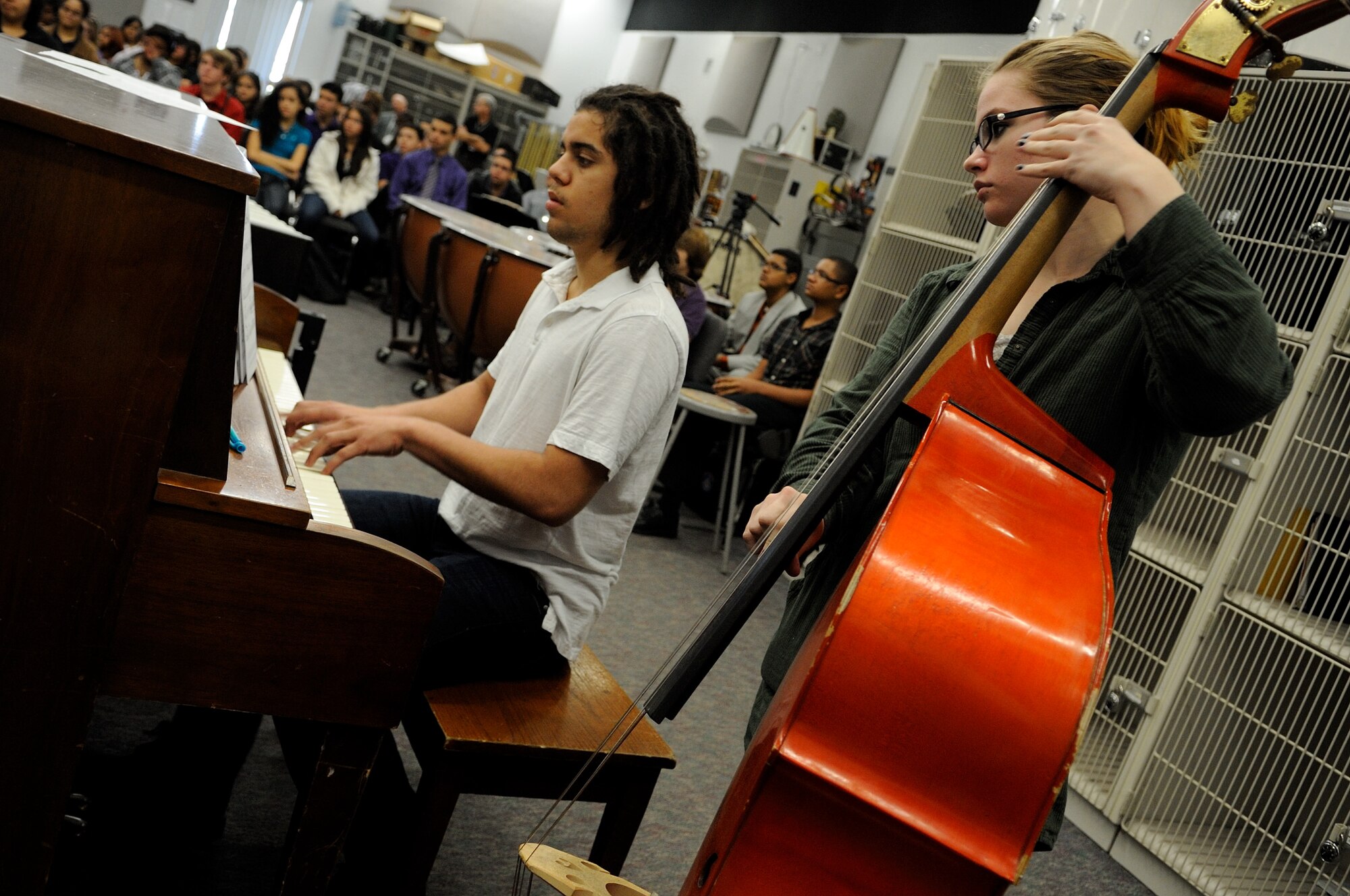 Nicholoas Carrero and Jessica Roehrick play a piece during a clinic with the U.S. Air Force Band Ceremonial Brass at Osceola County School for the Arts in Kissimmee, Fla., Jan. 18, 2012.  The U.S. Air Force Band conducts the education outreach programs to teach middle and high school students about the importance of life skills such as discipline, teamwork and perseverence. U.S. Air Force photo by Master Sgt. Adam M. Stump/RELEASED.