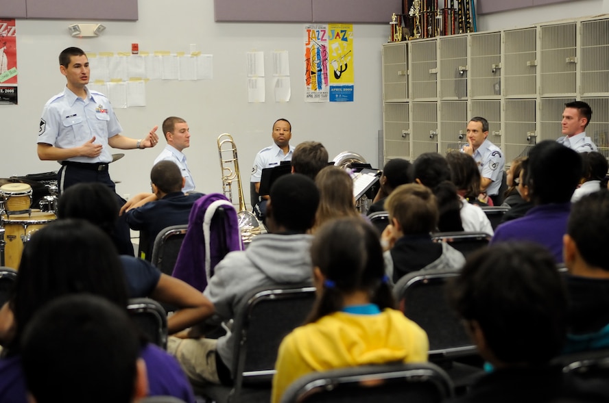 U.S. Air Force Master Sgt. Brett Miller, a French hornist with the U.S. Air Force Band Ceremonial Brass and a Boardman, Ohio, native, talks to students during a clinic at the Osceola County School for the Arts in Kissimmee, Fla., Jan. 18, 2012.  The U.S. Air Force Band conducts the education outreach programs to teach middle and high school students about the importance of life skills such as discipline, teamwork and perseverence. U.S. Air Force photo by Master Sgt. Adam M. Stump/RELEASED.