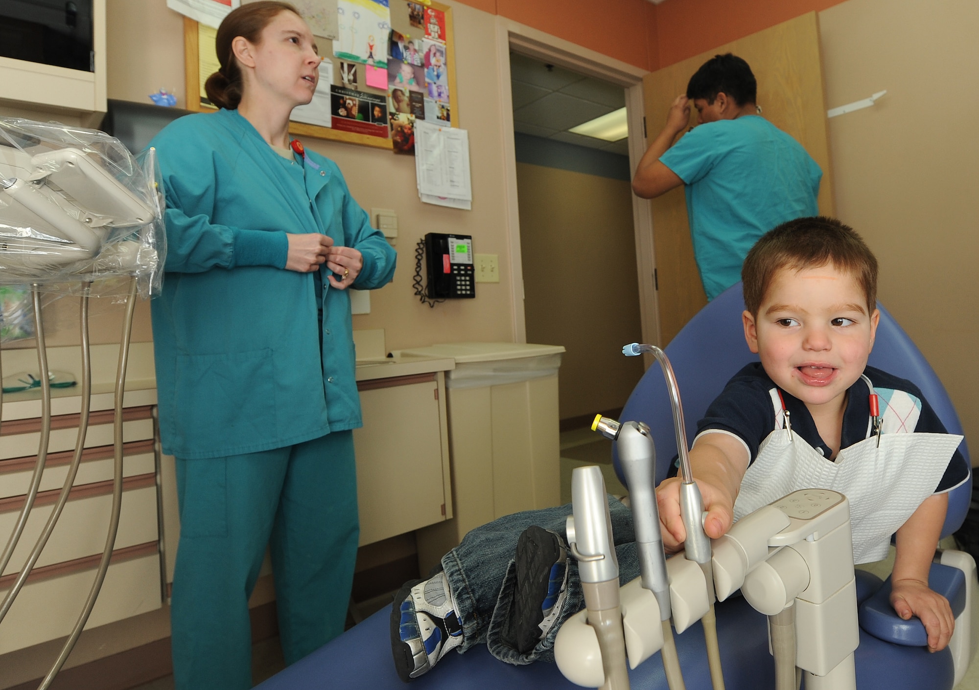 Brandon Neece, son of Anthony Neece, retired Master Sgt., observes dental equipment prior to a dental exam Jan. 17, 2012, at Nellis Air Force Base, Nev. February is Children's Dental Health Month.  During the month, Airmen from the 99th Dental Squadron plan to educate military dependents on proper oral hygiene. They also will volunteer with Las Vegas valley dentists to assist with cleaning, general dentistry and special care for those in need. (U.S. Air Force photo by Staff Sgt. Christopher Hubenthal/Released)
