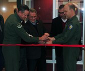 MINOT AIR FORCE BASE, N.D. -- Col. Bryan Haderlie, 91st Operations Group commander and Col. S.L. Davis, 91st Missile Wing commander, join Senator Randy Burckhard, 91st MW honorary commander and John Knecht, 91st Operations Support Squadron honorary commander, in a ribbon-cutting ceremony for the unveiling of the new Missile Operations Building here Jan. 13. The Missile Operations Building is the newest facility for missile operations at Minot AFB. (U.S. Air Force photo/Airman 1st Class Kristoffer Kaubisch)