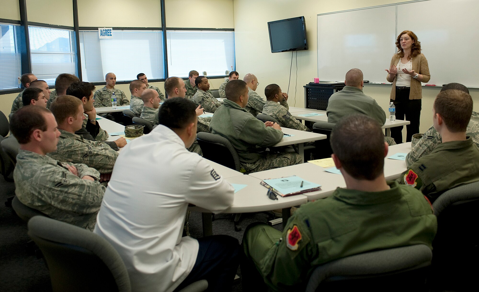 Lisa Surette, 99th Air Base Wing sexual assault response coordinator, speaks to a group of Airmen during a Bystander Intervention Training course Jan. 17, 2012, at Nellis Air Force Base, Nev. Airmen are required to complete the course by June 2012. (U.S. Air Force photo by Staff Sgt. Christopher Hubenthal/Released)